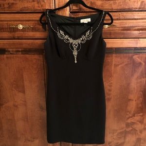 Dress with crystal trim at neckline